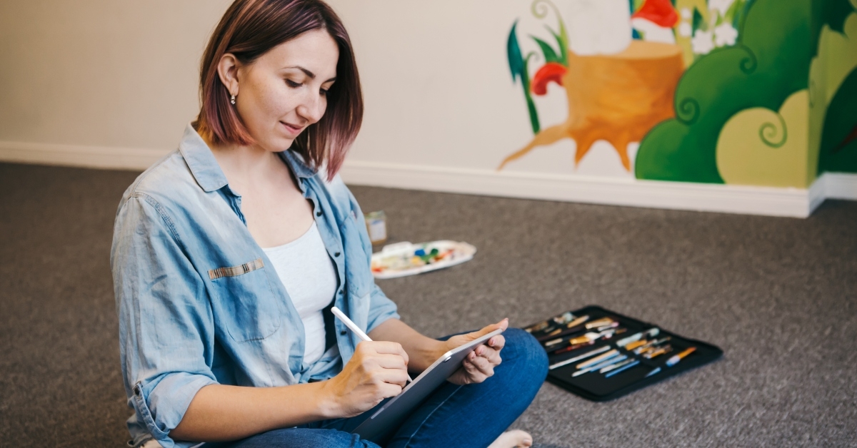 female artist drawing on a touch pad digital tablet