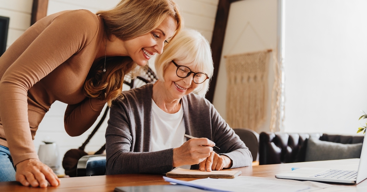 investment advisor consulting with retired woman at home