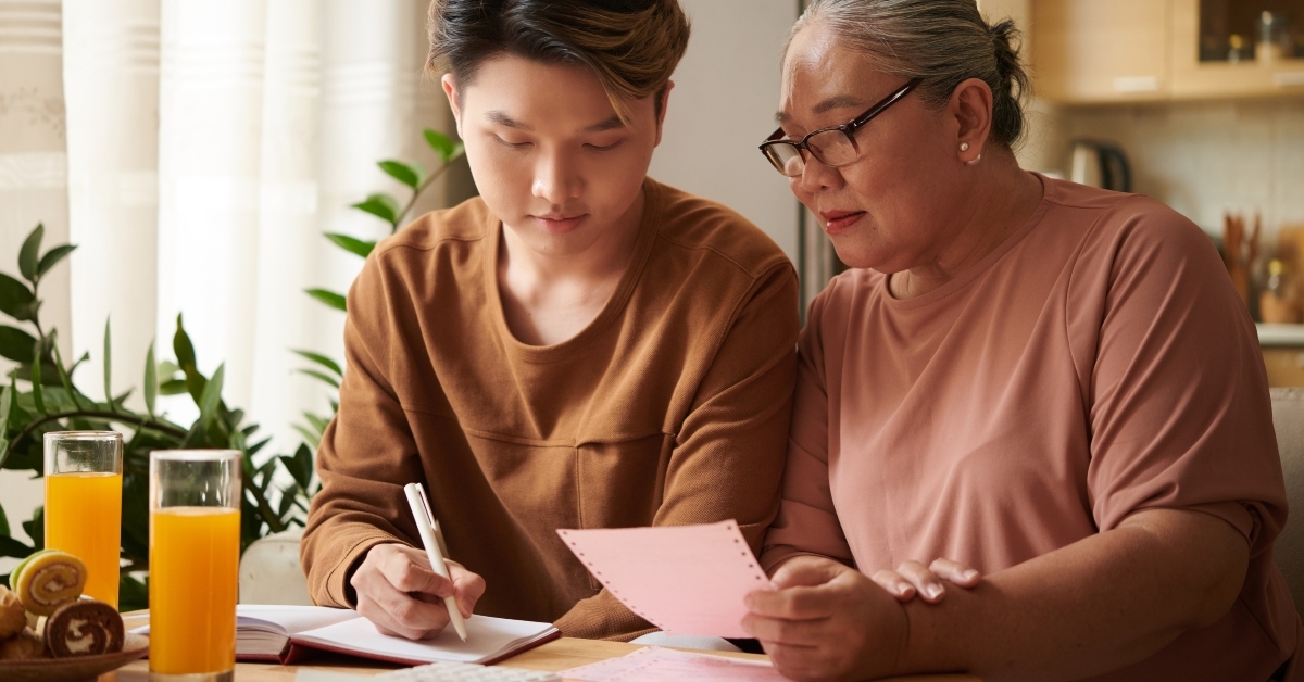 senior woman learning how to track expenses