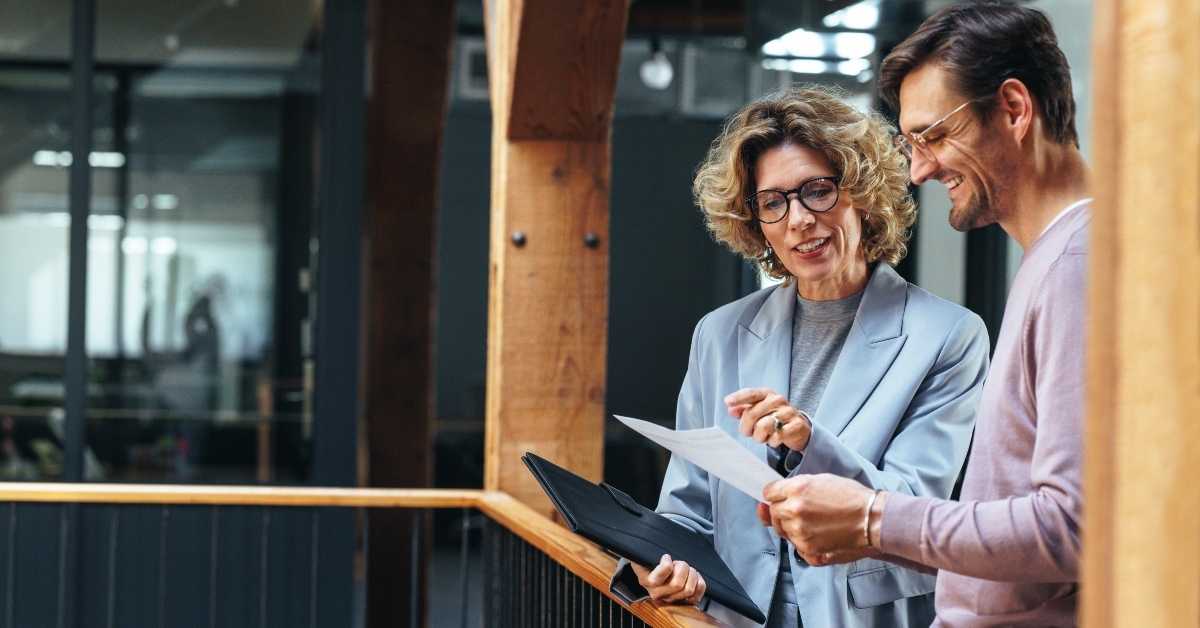businesspeople analyzing a financial report together