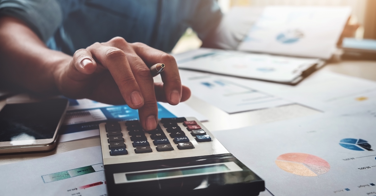 businessman using calculator