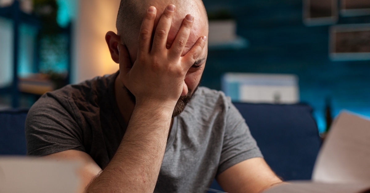 worried person with depression reading eviction notice paper