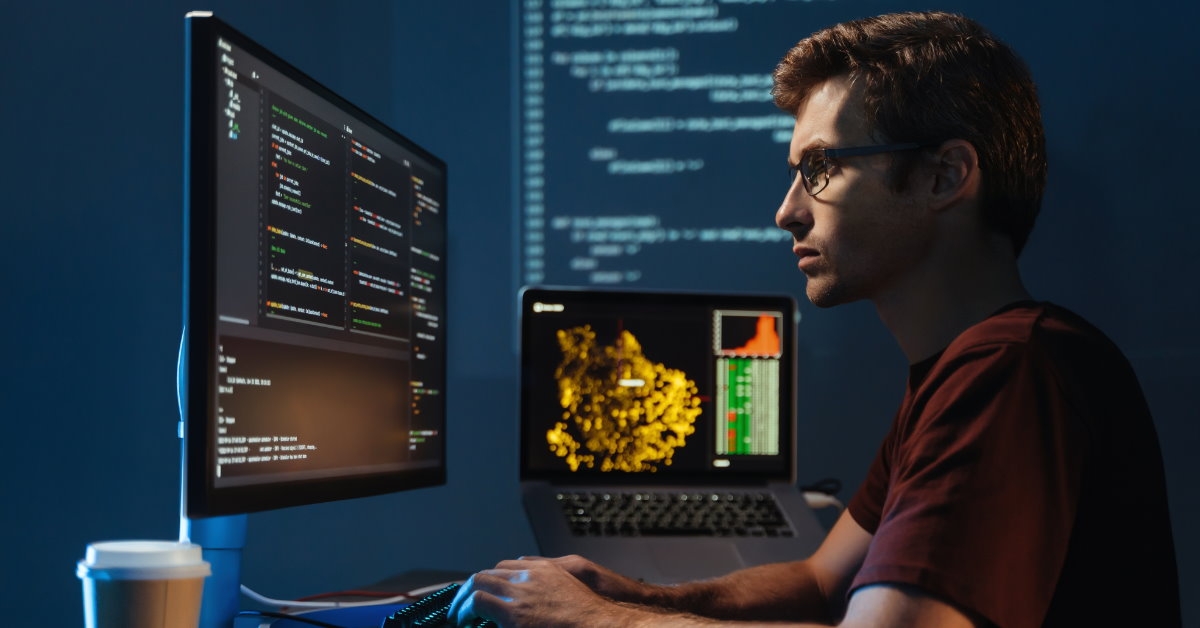 male data scientist coding at home late night