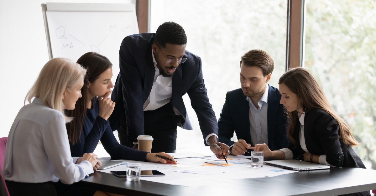 male boss work with diverse team at office briefing