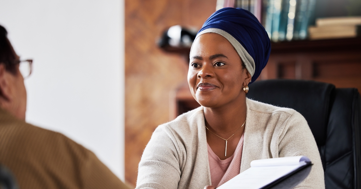 woman with senior planning on documents for contract