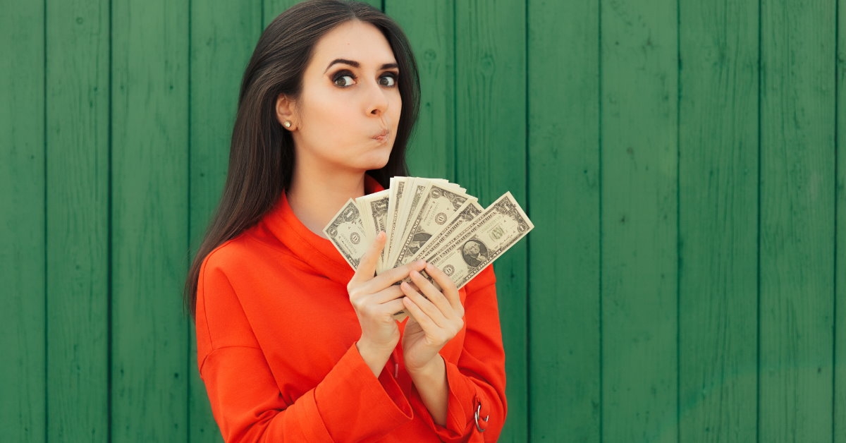woman holding money in hand