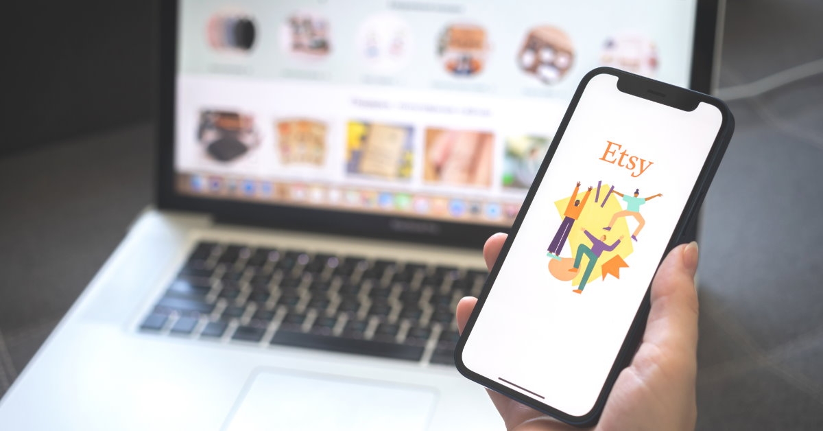 woman checking etsy on laptop and smartphone 