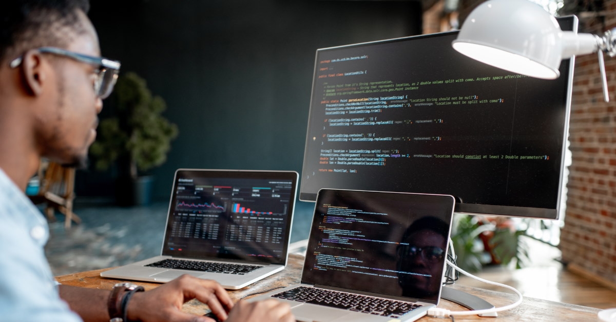african american man writing code 