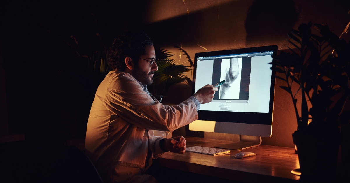 intern using marker to understand graphics on computer