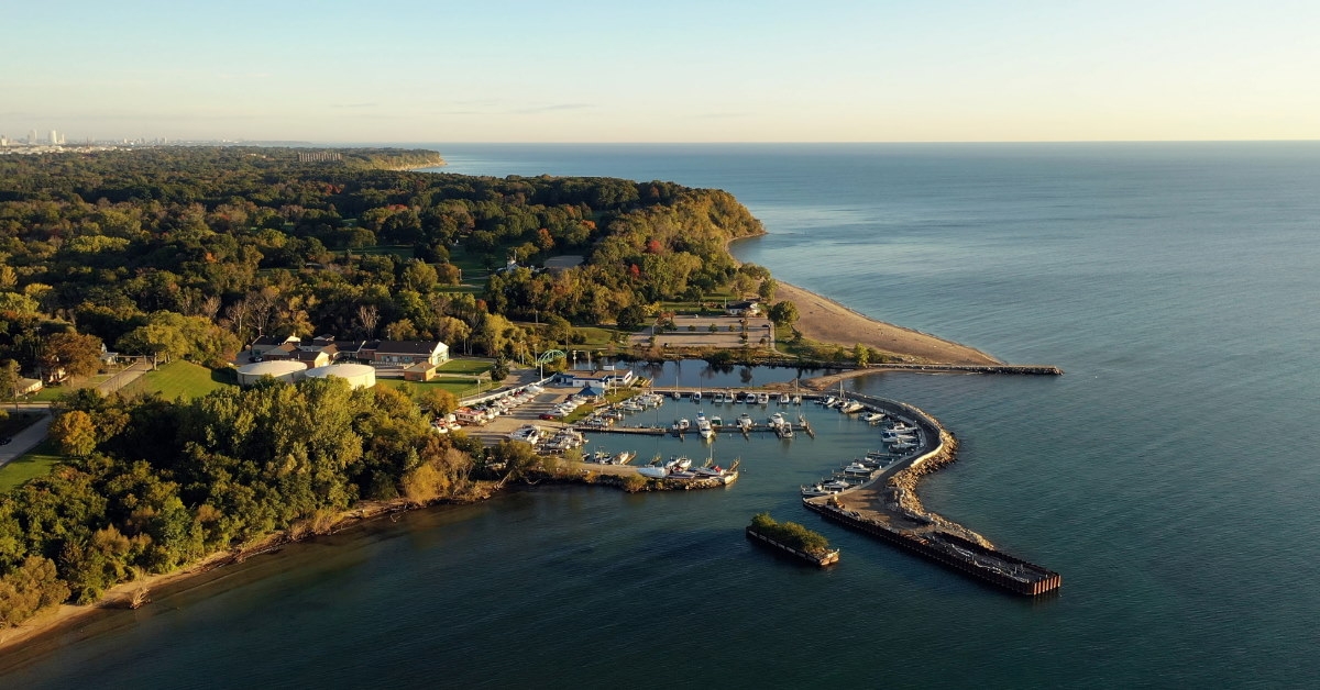boat pier beach with green trees and forests at lake Michigan 