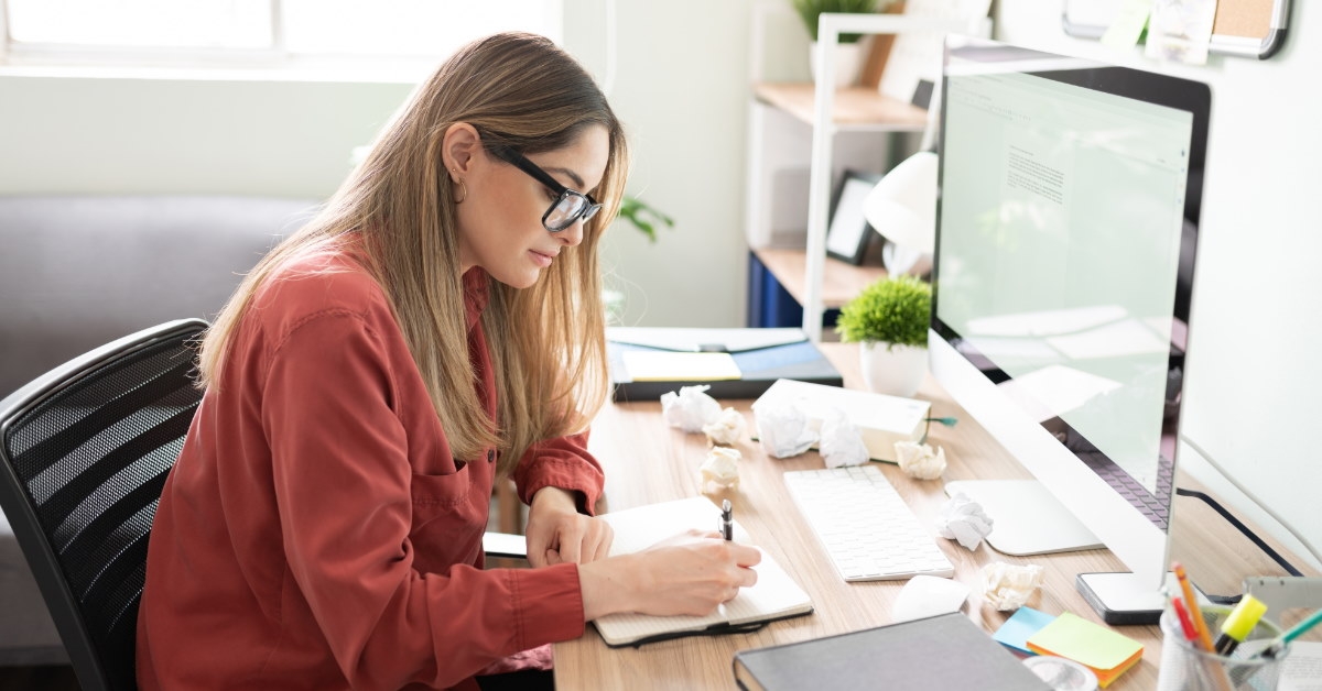 female author writing on a diary