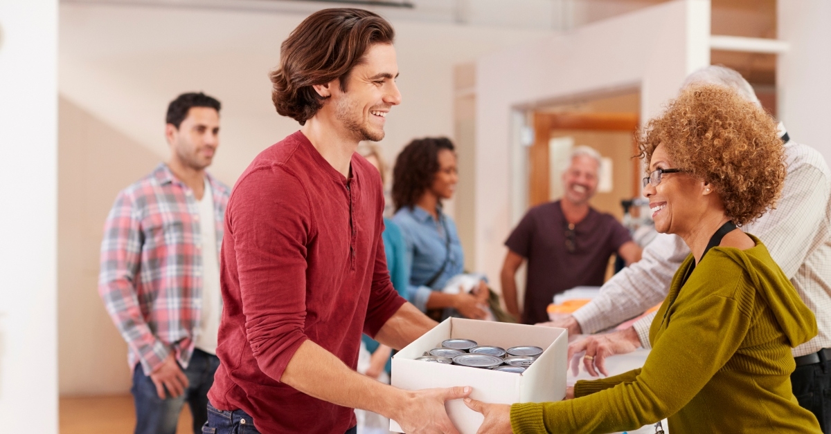 people donating food to charity food bank