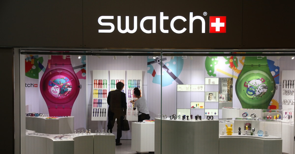 man shopping for watches at swatch watch store in osaka japan