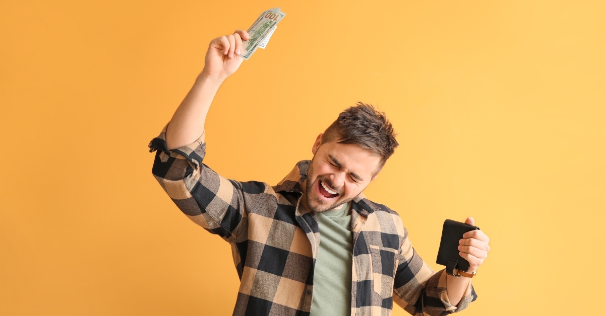  man with purse and money