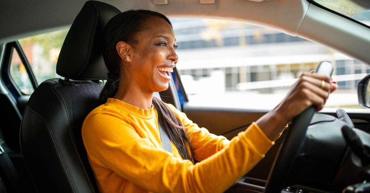 Smiling woman driving