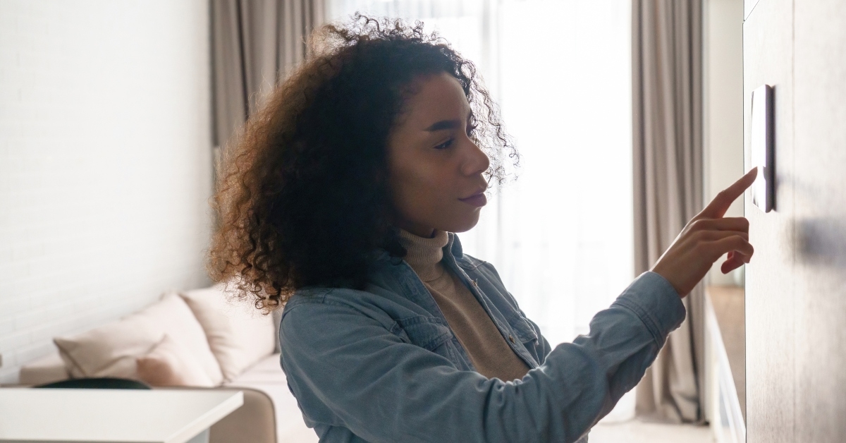 woman using smart home touch screen