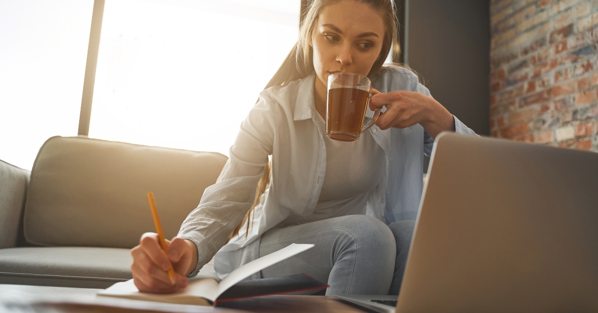 woman with a pencil making a grocery list