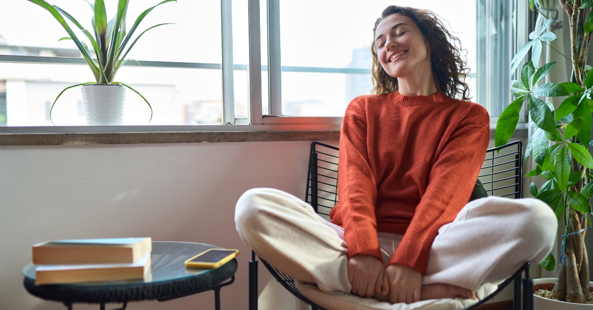 woman relaxing while sitting on chair