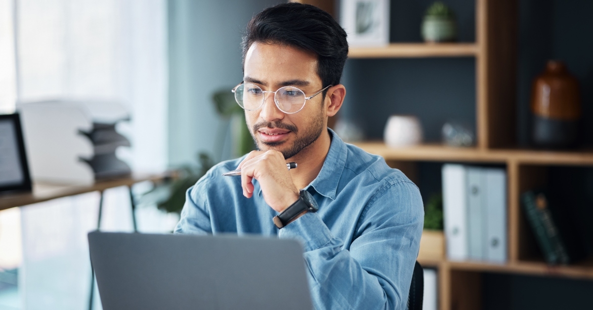 businessman thinking at laptop