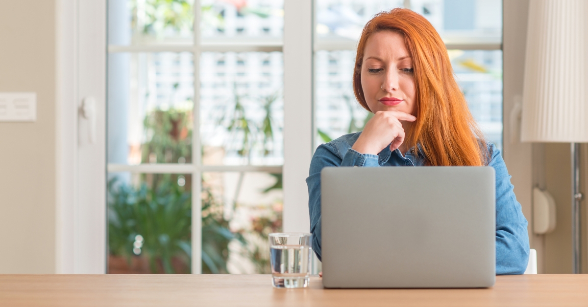 redhead woman using computer laptop