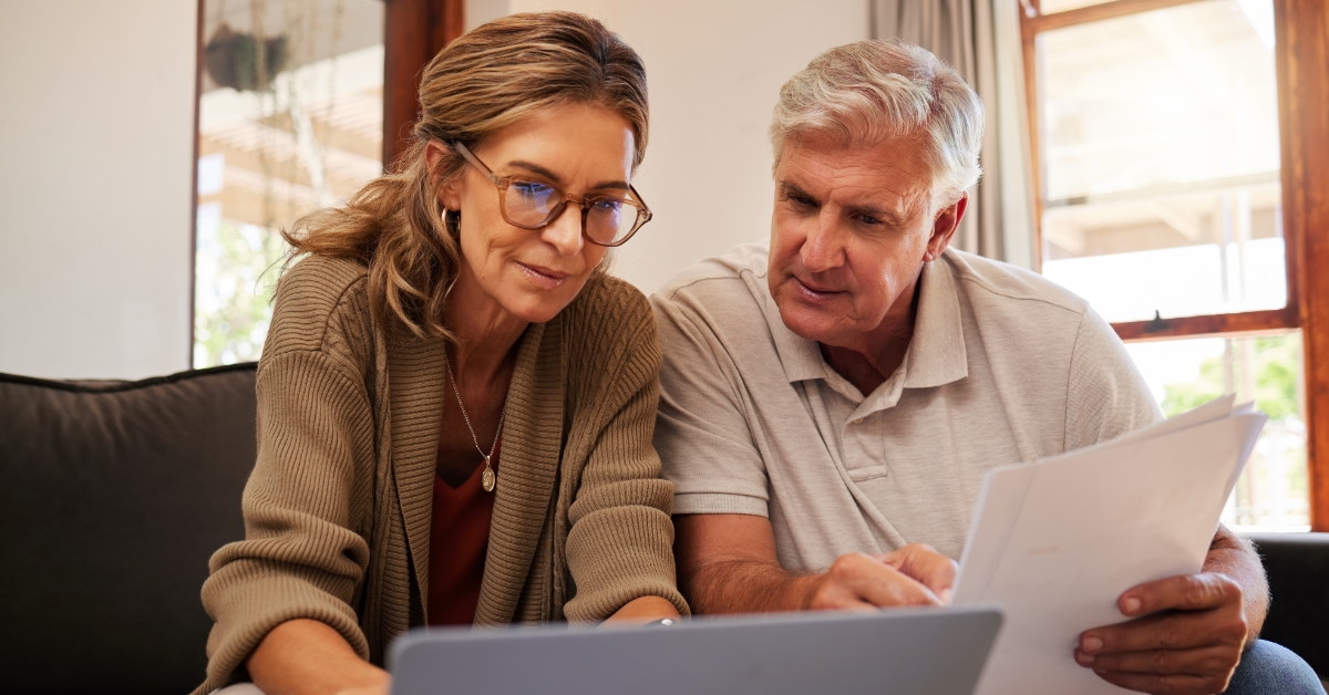 senior couple reviewing bills at home
