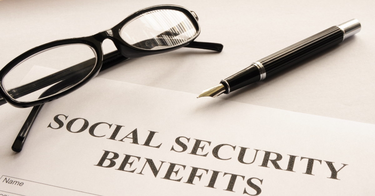social security benefits form with glasses and pen