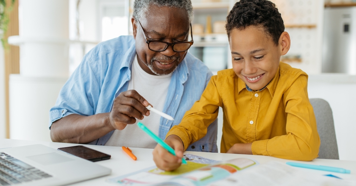 grandfather tutoring his grandson