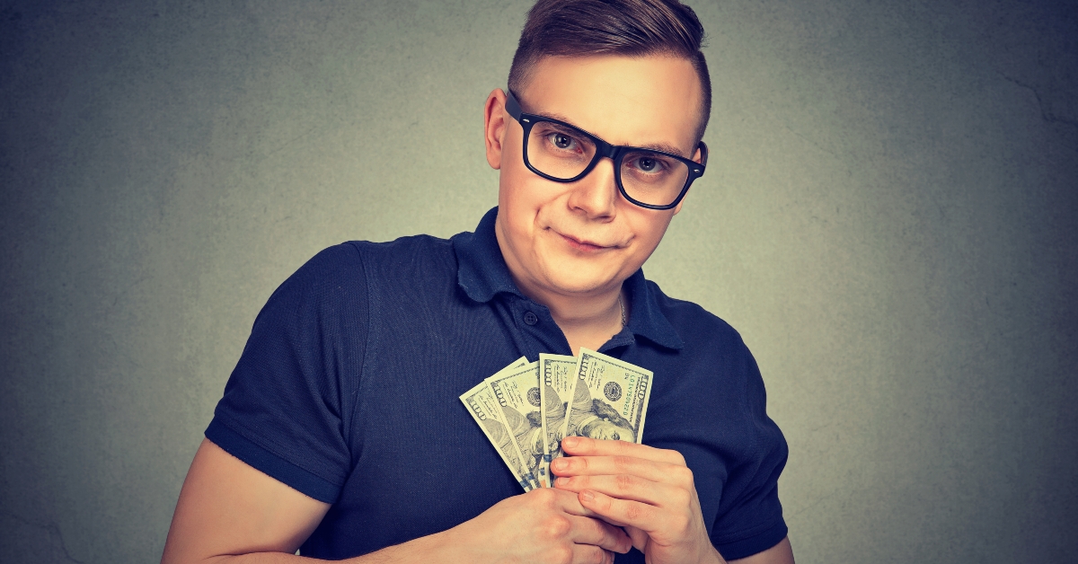 suspicious greedy man with money