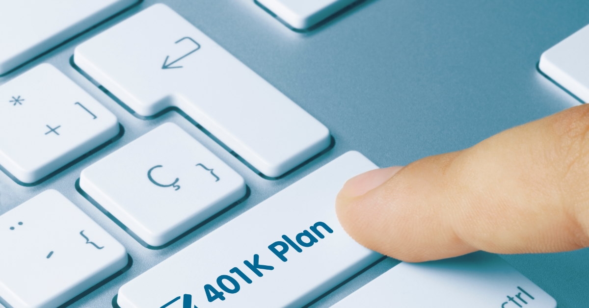 hand pressing 401k plan key on keyboard 