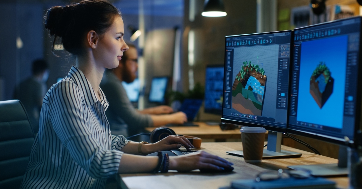 female game developer works on a level design 