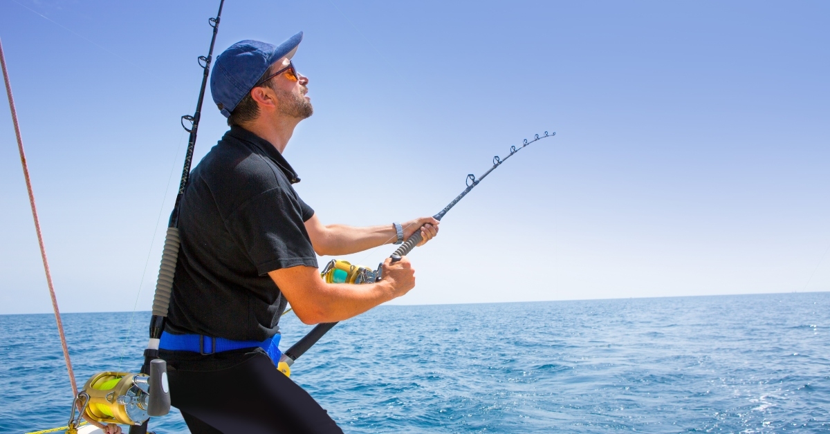 blue sea offshore fishing boat with fisherman