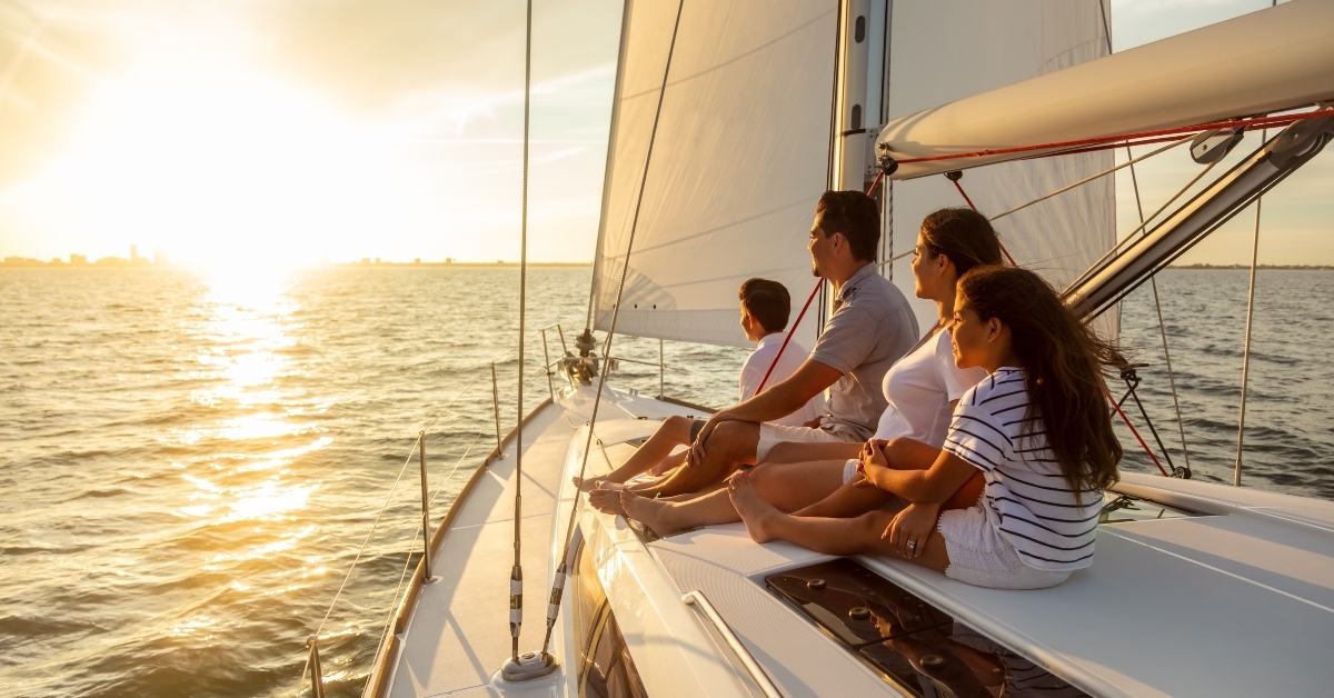 family travel adventures on luxury yacht at sunset