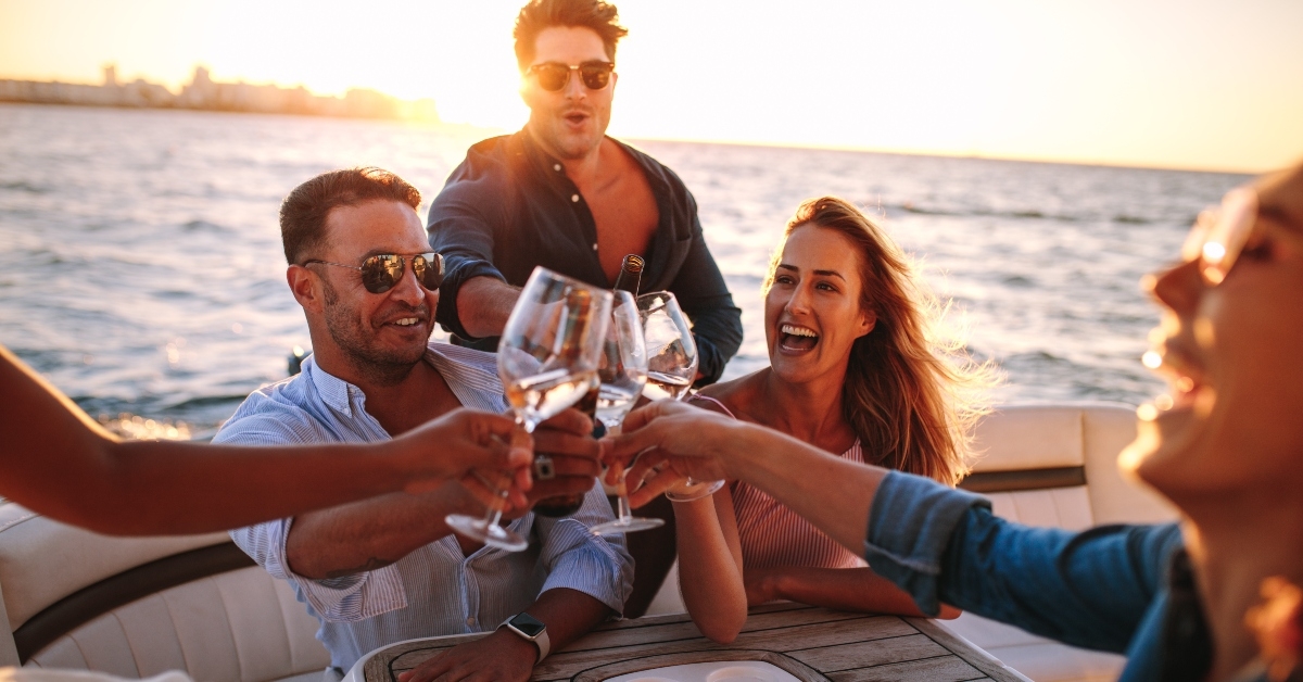 friends on yacht drinking together