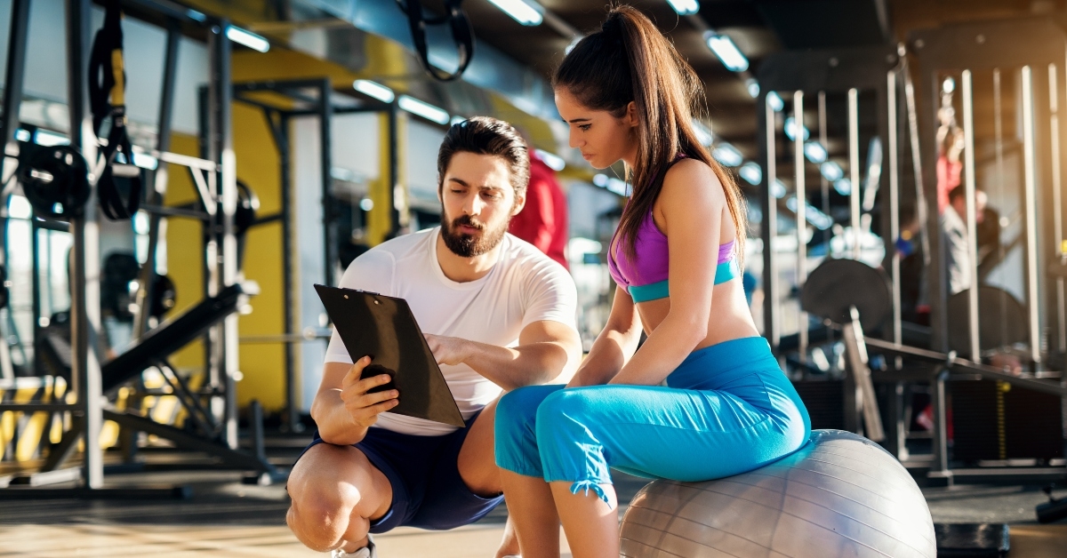 healthy active woman sitting on the gym ball