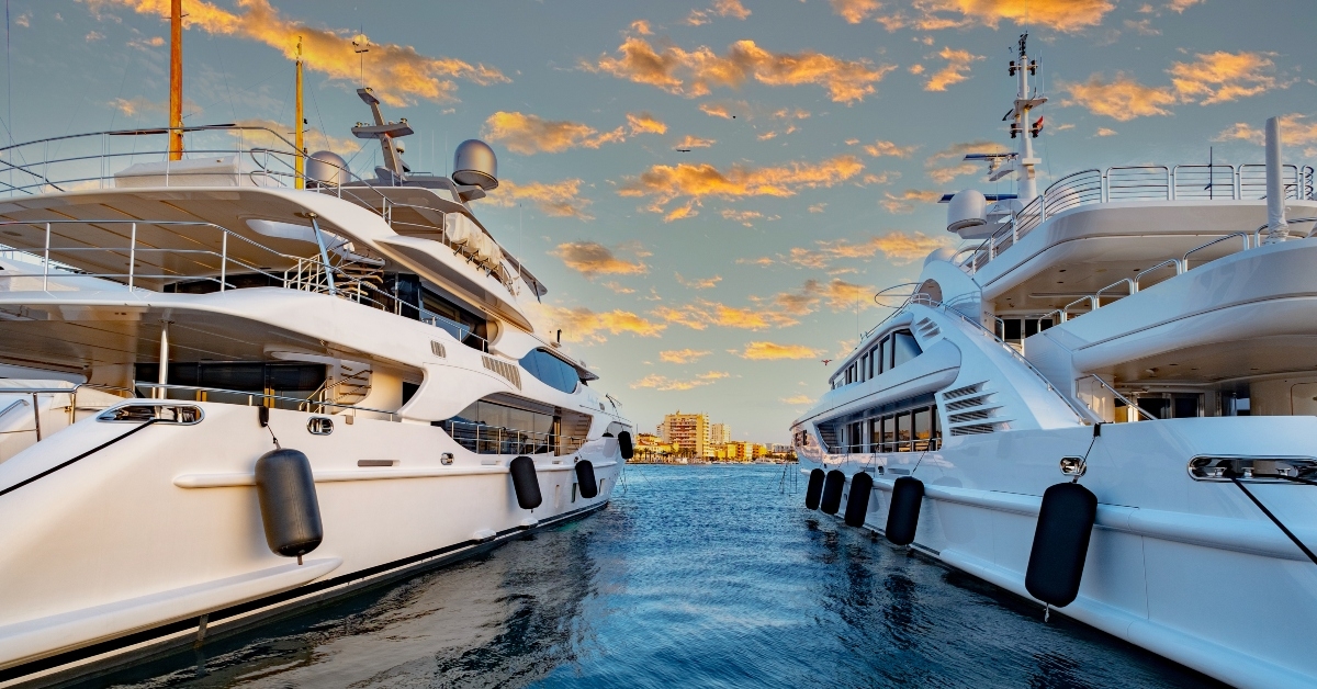 luxury yacht in a harbor during sunset