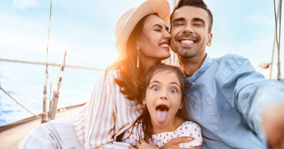 young family resting on yacht