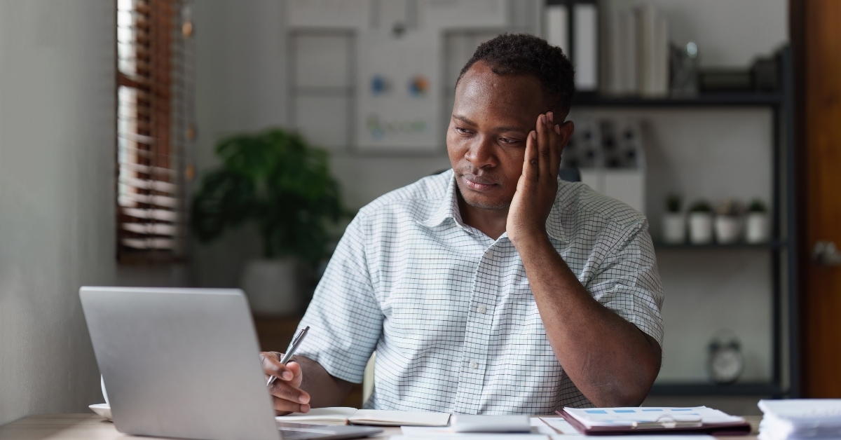 businessman in stress works with many paperwork