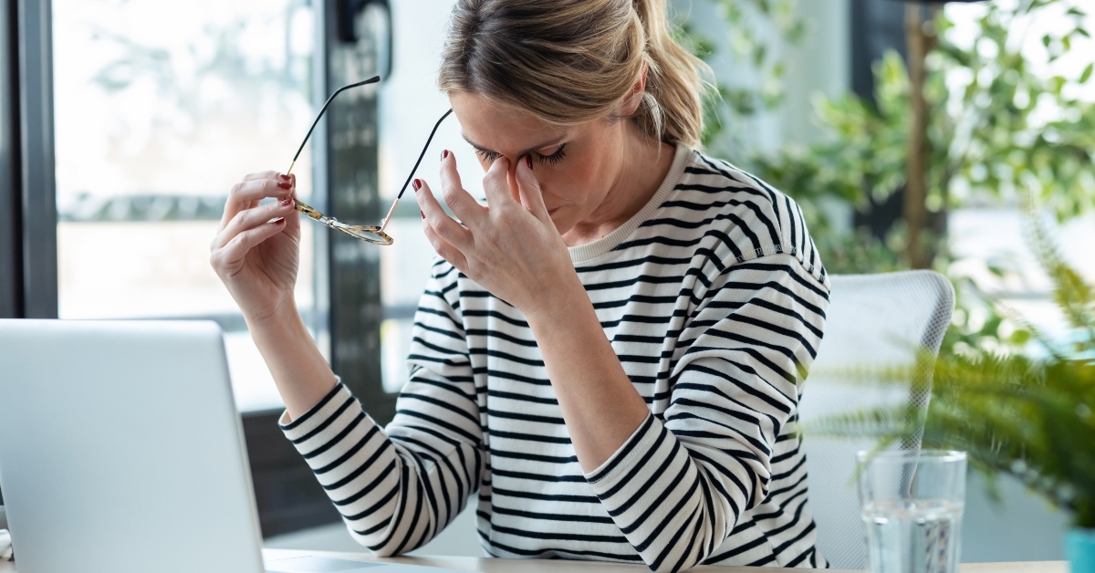 stressed mature businesswoman looking worried