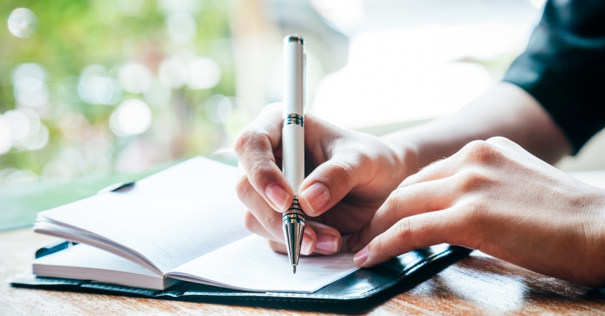 woman writing her journal 