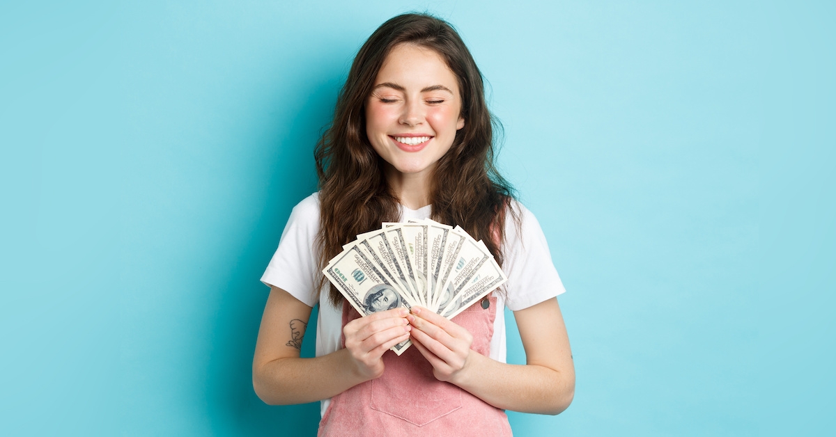 Young woman holding money