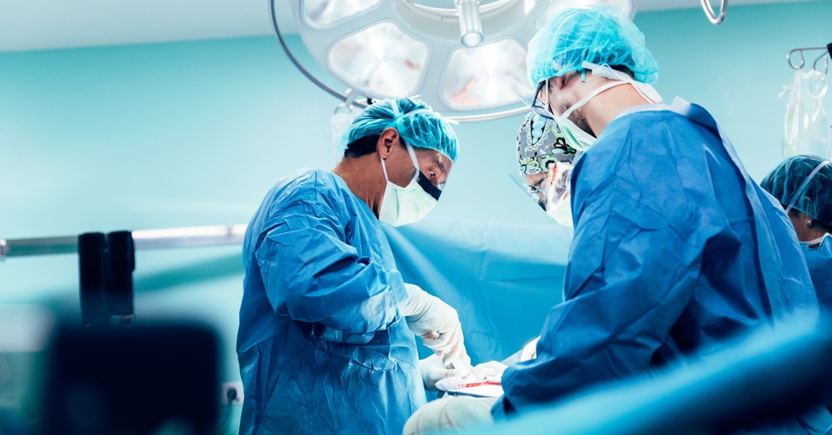 team of surgeons performing surgery on patient inside operation theatre