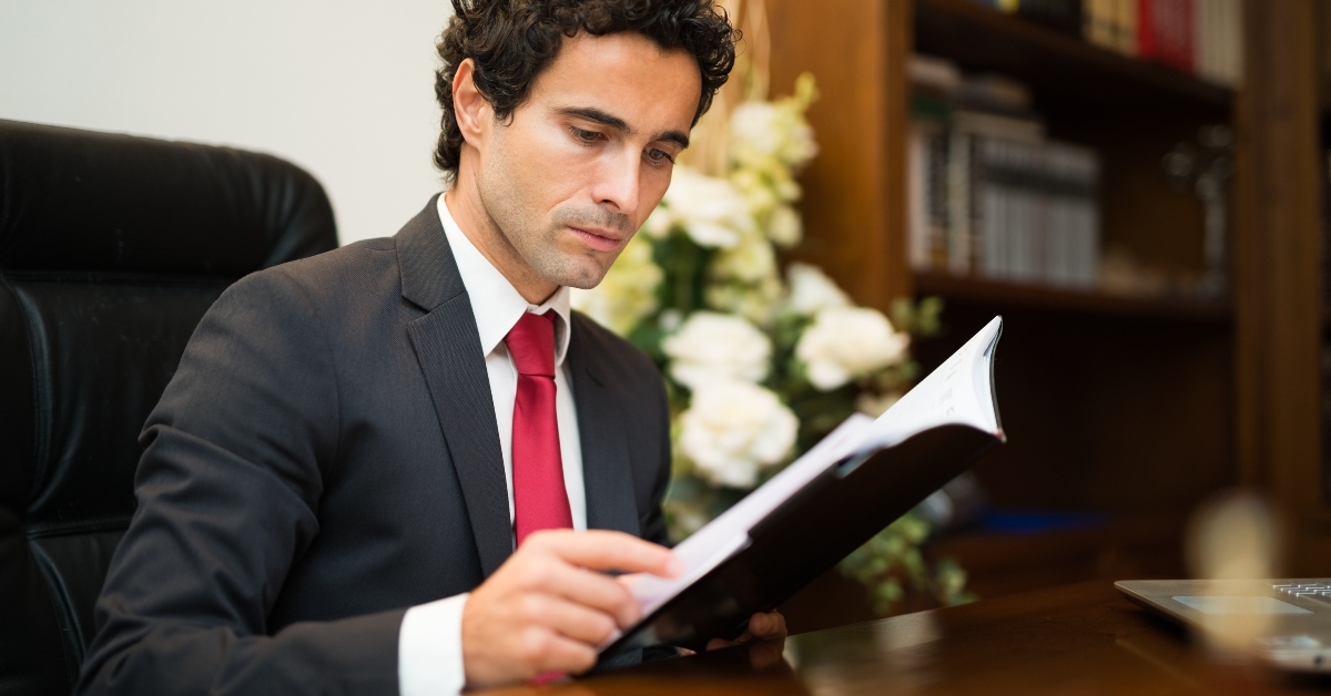 businessman reading his agenda