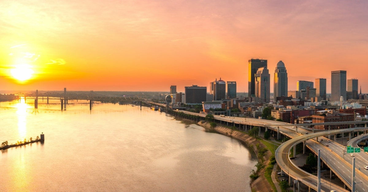 louisville city skyscrapers surrounded by bridges and greenery