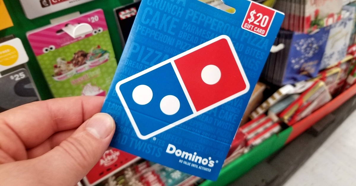 Dominos Pizza gift card in a hand