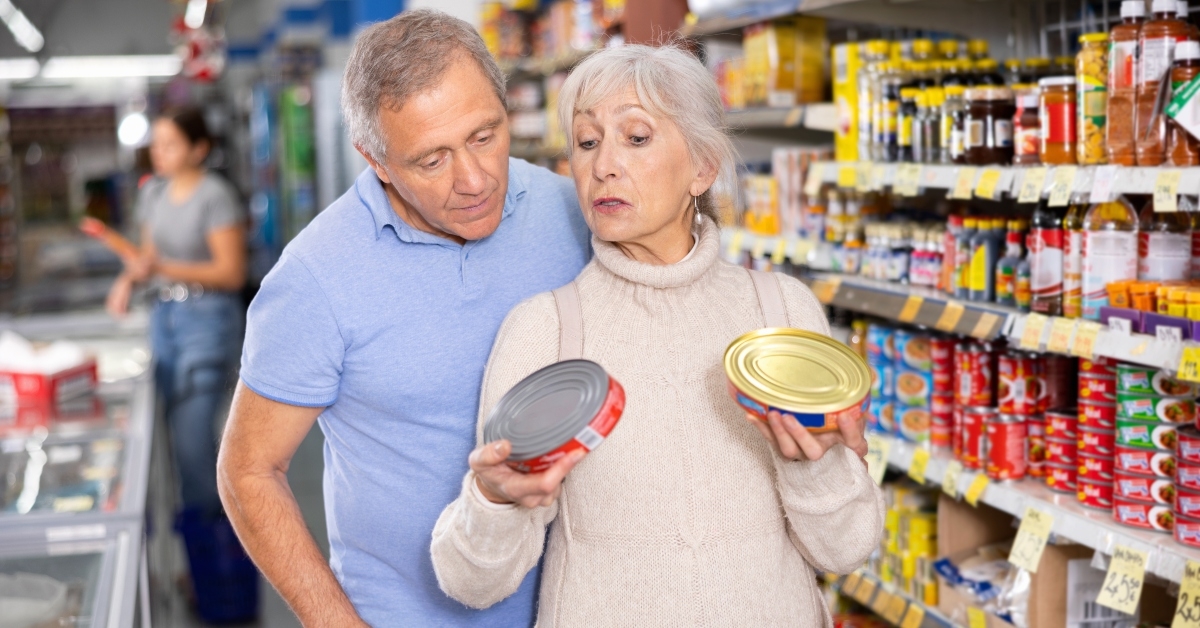 husband and wife choose canned food together