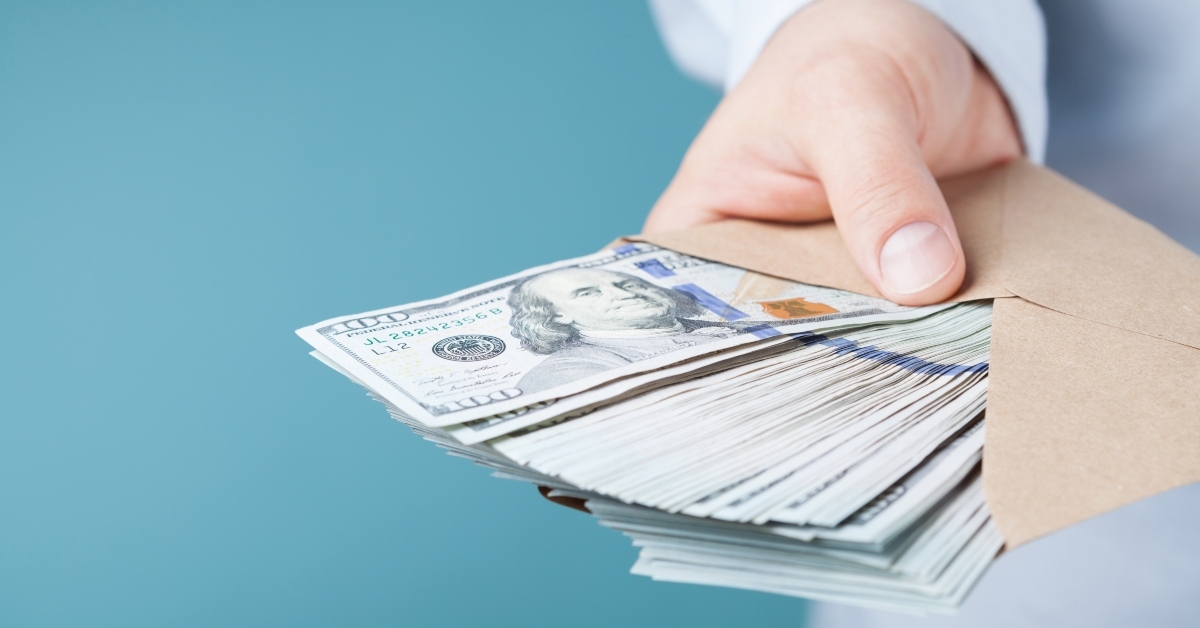 businessman giving cash money