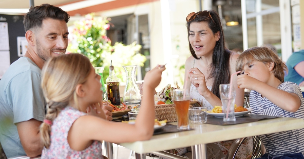 family on vacation having lunch at hotel restaurant