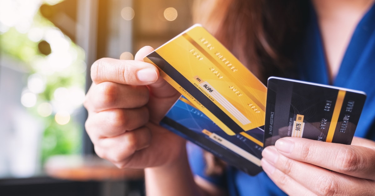 woman picking credit card to make payment