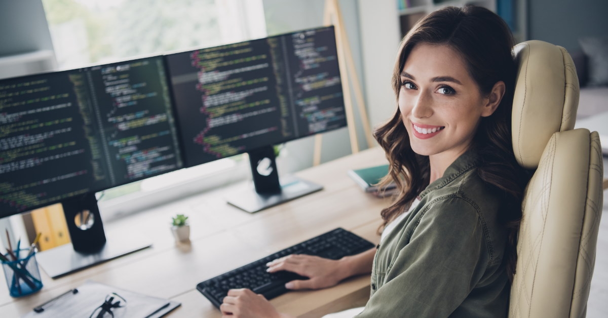 female programmer writing computer code 