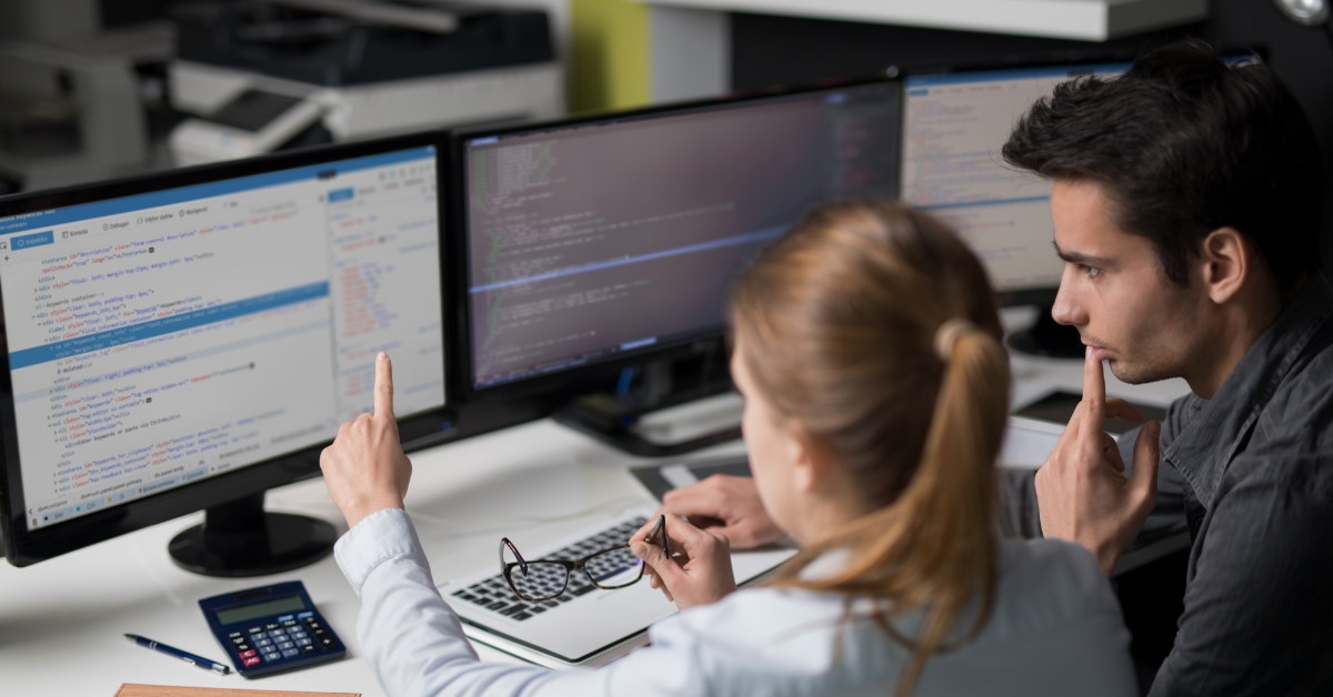 male and female colleagues working on software development together.